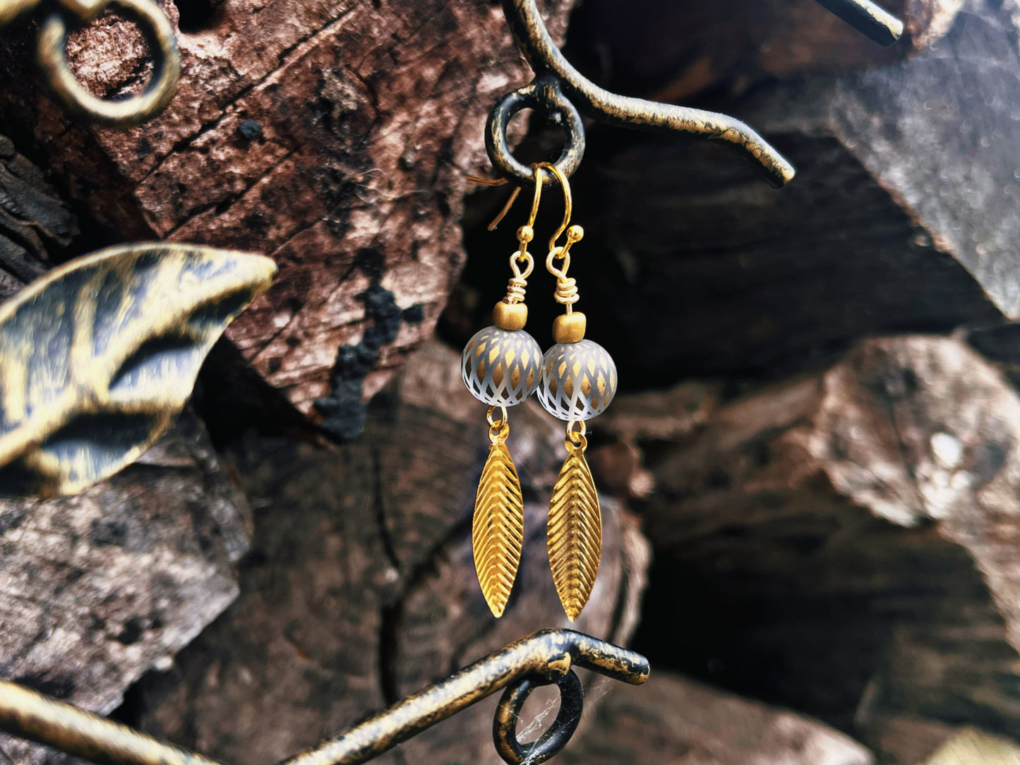 Gold feather earrings