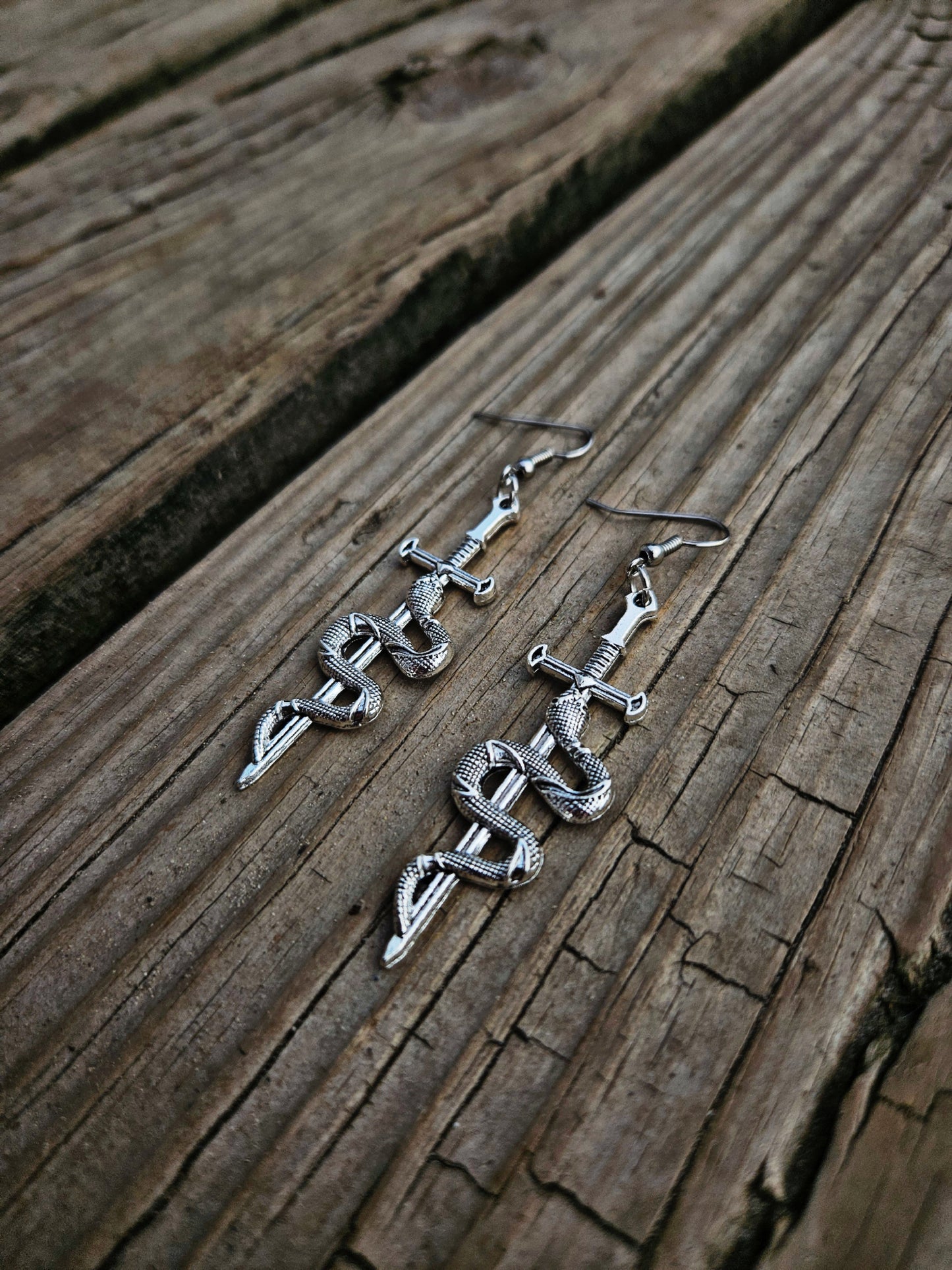 Silver snake/ sword earrings